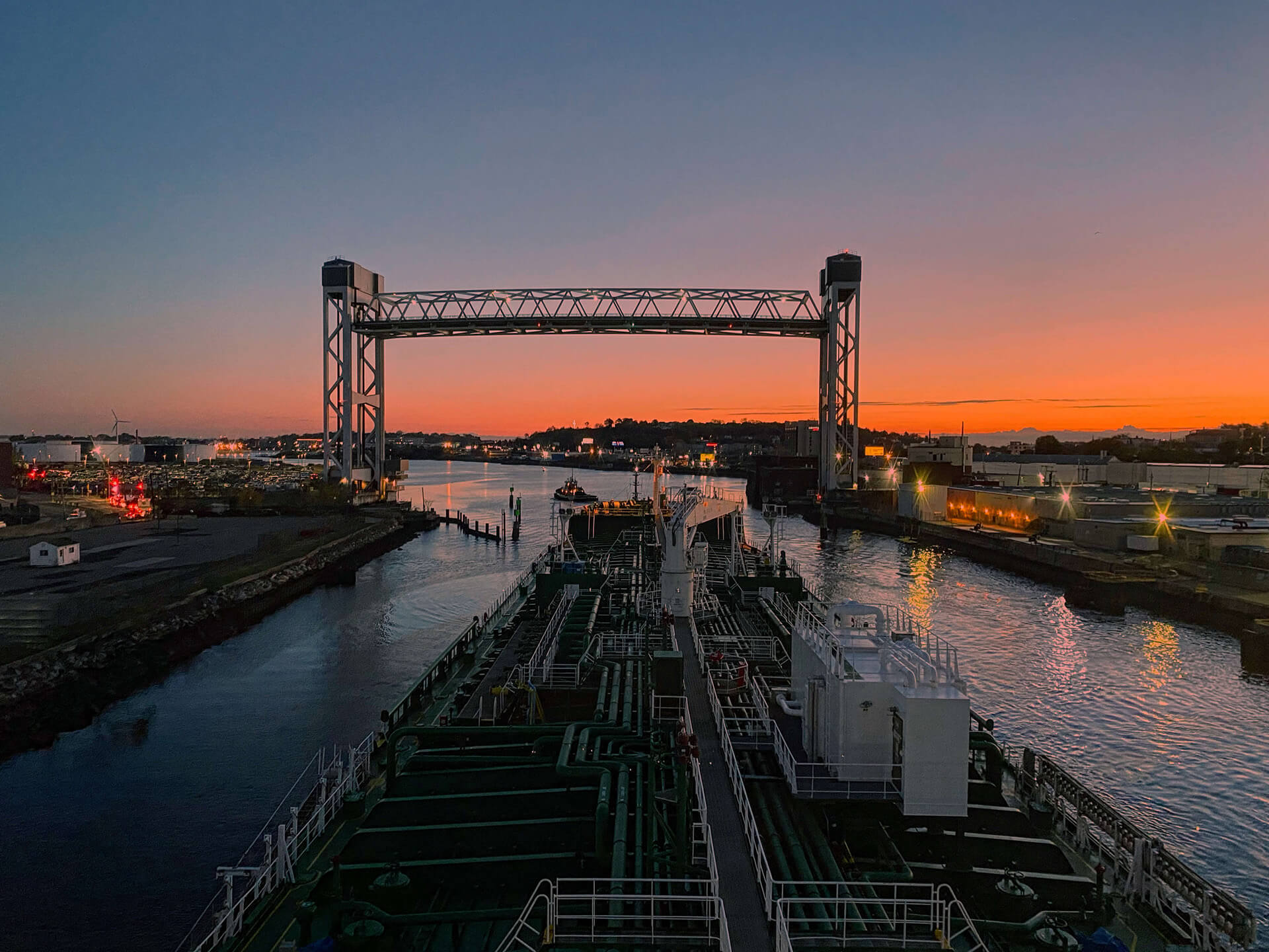 Large ship docking in the bay at sunset